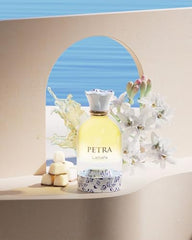 Lattafa Petra fragrance close-up showing plum and tuberose for evening allure.