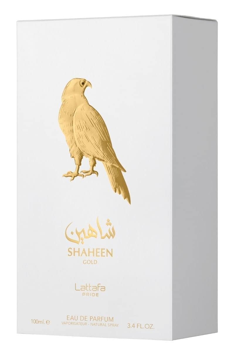 Lattafa Pride Shaheen Gold bottle on table emphasizes its unisex appeal for daily wear.