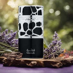 Lattafa Qimmah spray application demonstrates easy, controlled fragrance use.