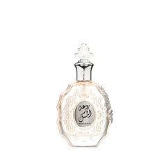 Lattafa Rouat Al Musk bottle close-up highlights premium amber floral design.