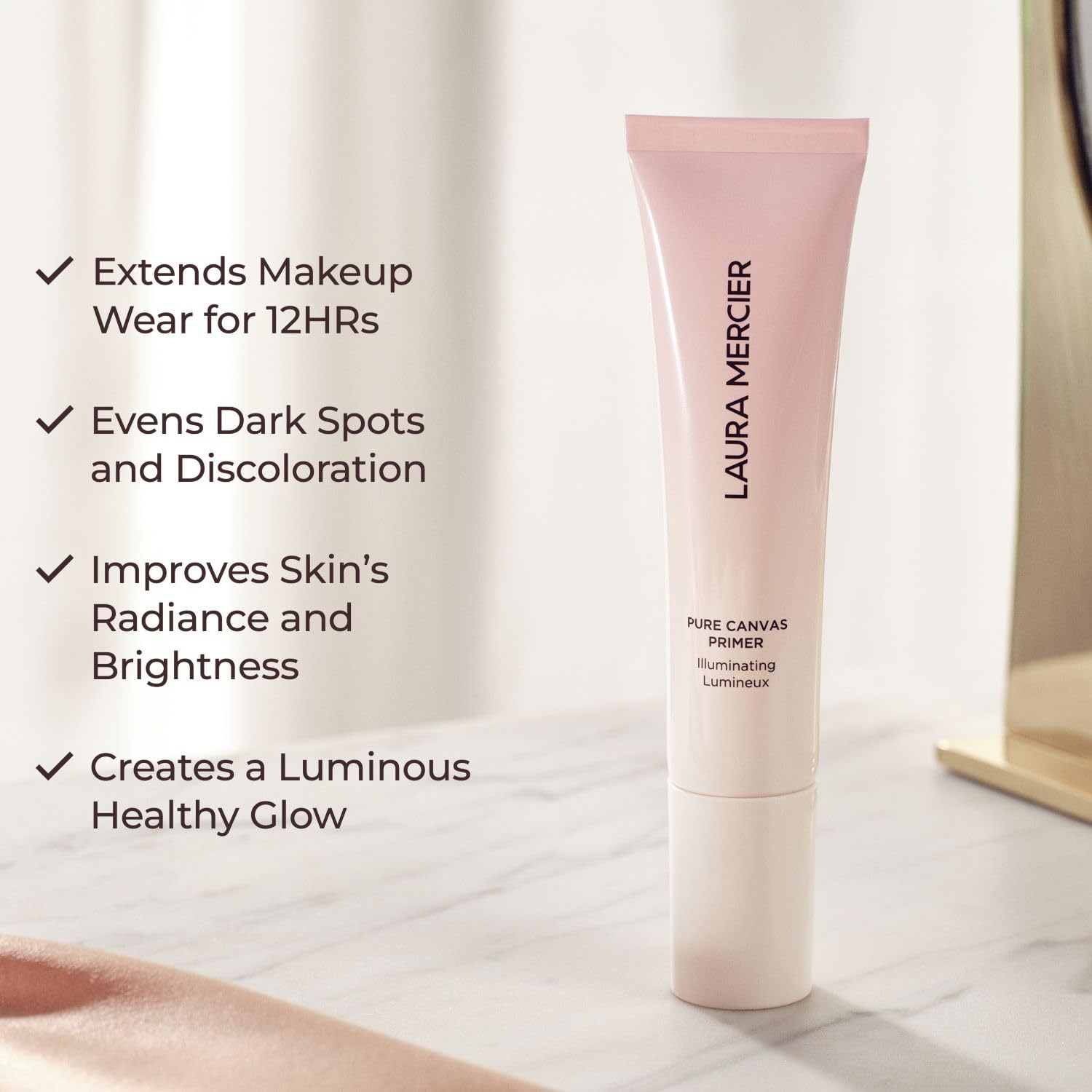 Laura Mercier Pure Canvas Primer close-up shows encapsulated luminous pearls for natural glow.