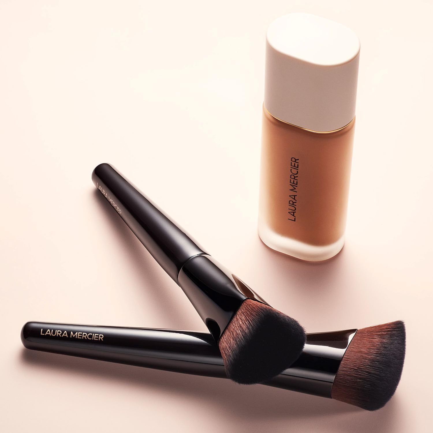 Laura Mercier Real Flawless Foundation Brush soft bristles for seamless blending.