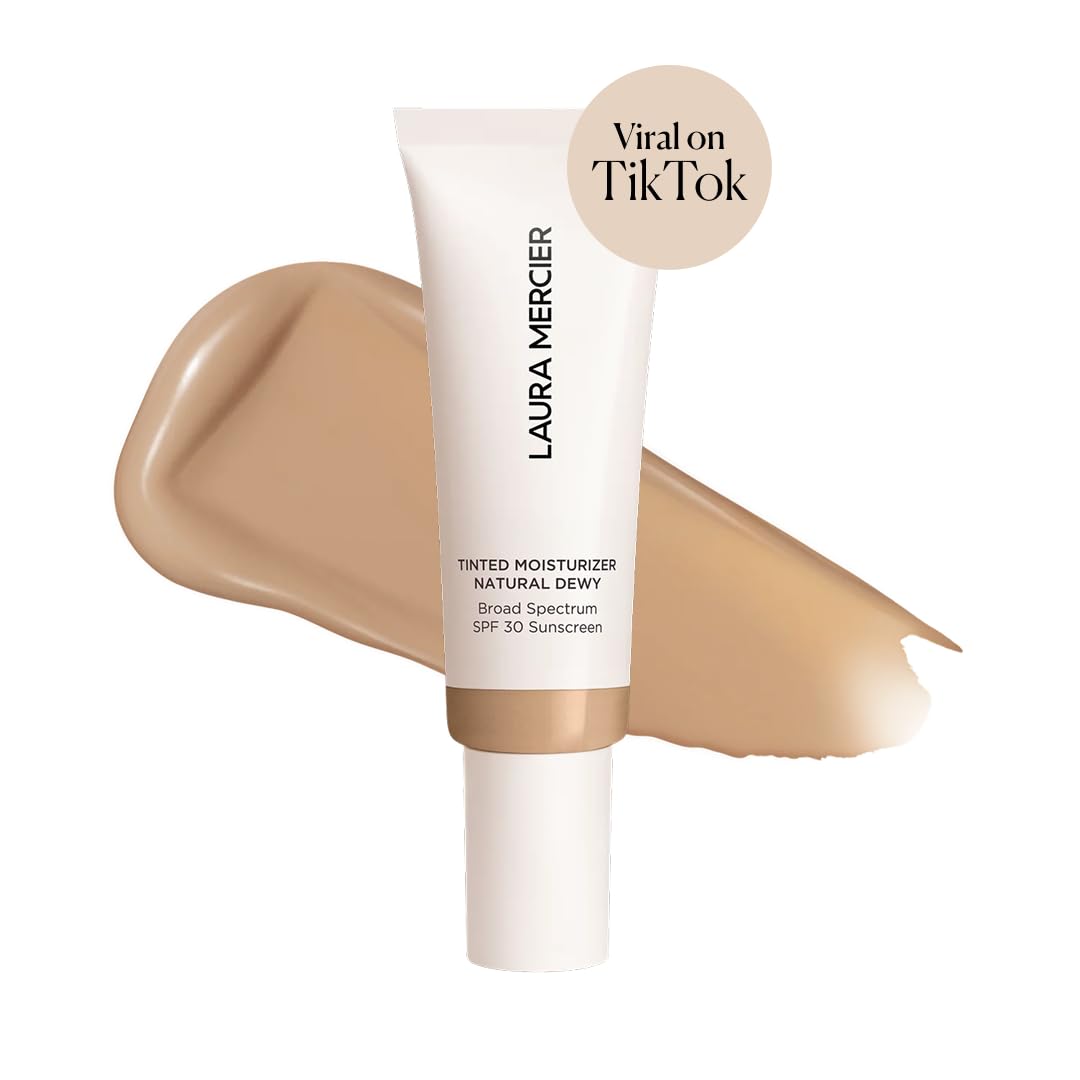 Laura Mercier tinted moisturizer sand packaging close-up highlights SPF 30 protection and sheer-to-light coverage.