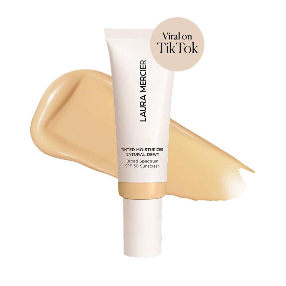 Laura Mercier Tinted Moisturizer texture swatch shows buildable sheer to light coverage.