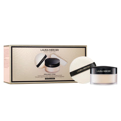 Laura Mercier translucent loose powder puff for long-lasting, shine-control wear.