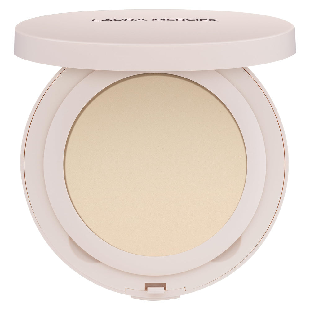Laura Mercier Ultra-Blur Powder Compact delivers pore-blurring translucent finish for long-lasting wear.
