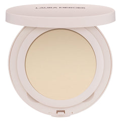 Laura Mercier Ultra-Blur Powder Compact delivers pore-blurring translucent finish for long-lasting wear.