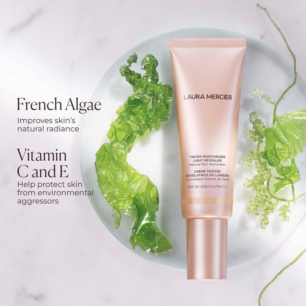 Laura Mercier application shot with fingertips reveals fast, natural glow.