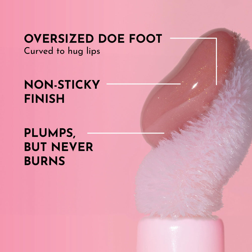 Lawless Forget The Filler Lip Plumper Line Gloss wand applying over lipstick for glow