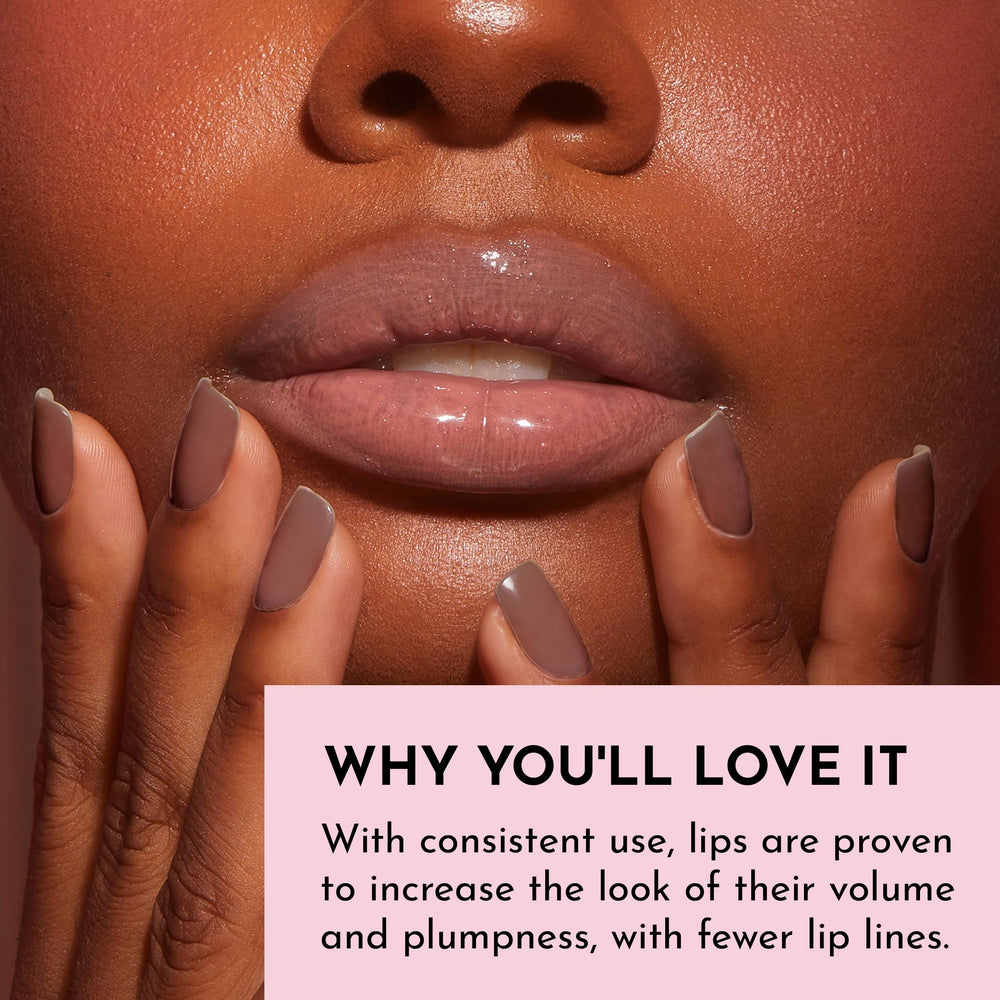 Lawless Nudie gloss on lips with glass-like topcoat and plumping effect
