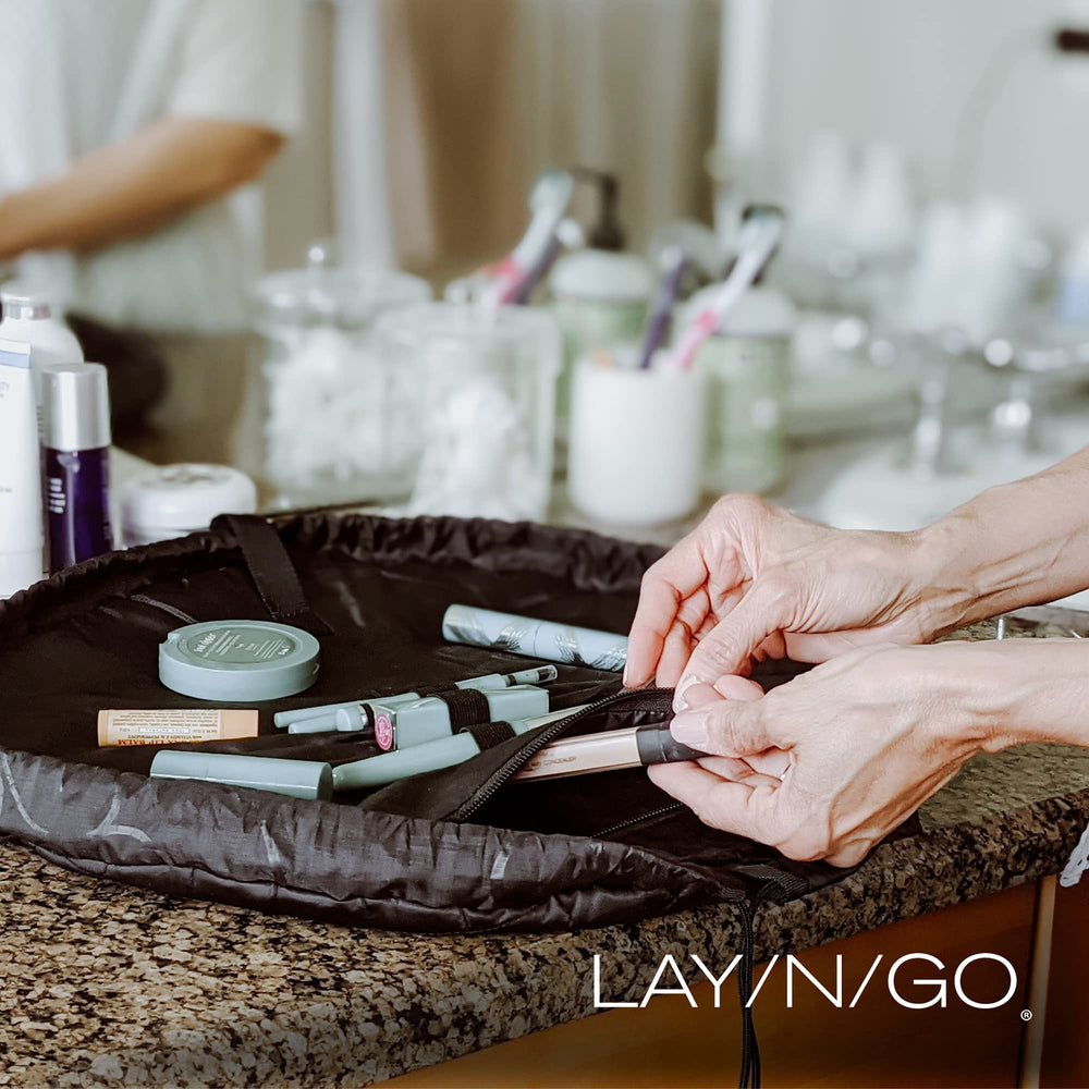 Lay-n-Go Cosmo bag travel-ready design fits hotel counters and gyms.