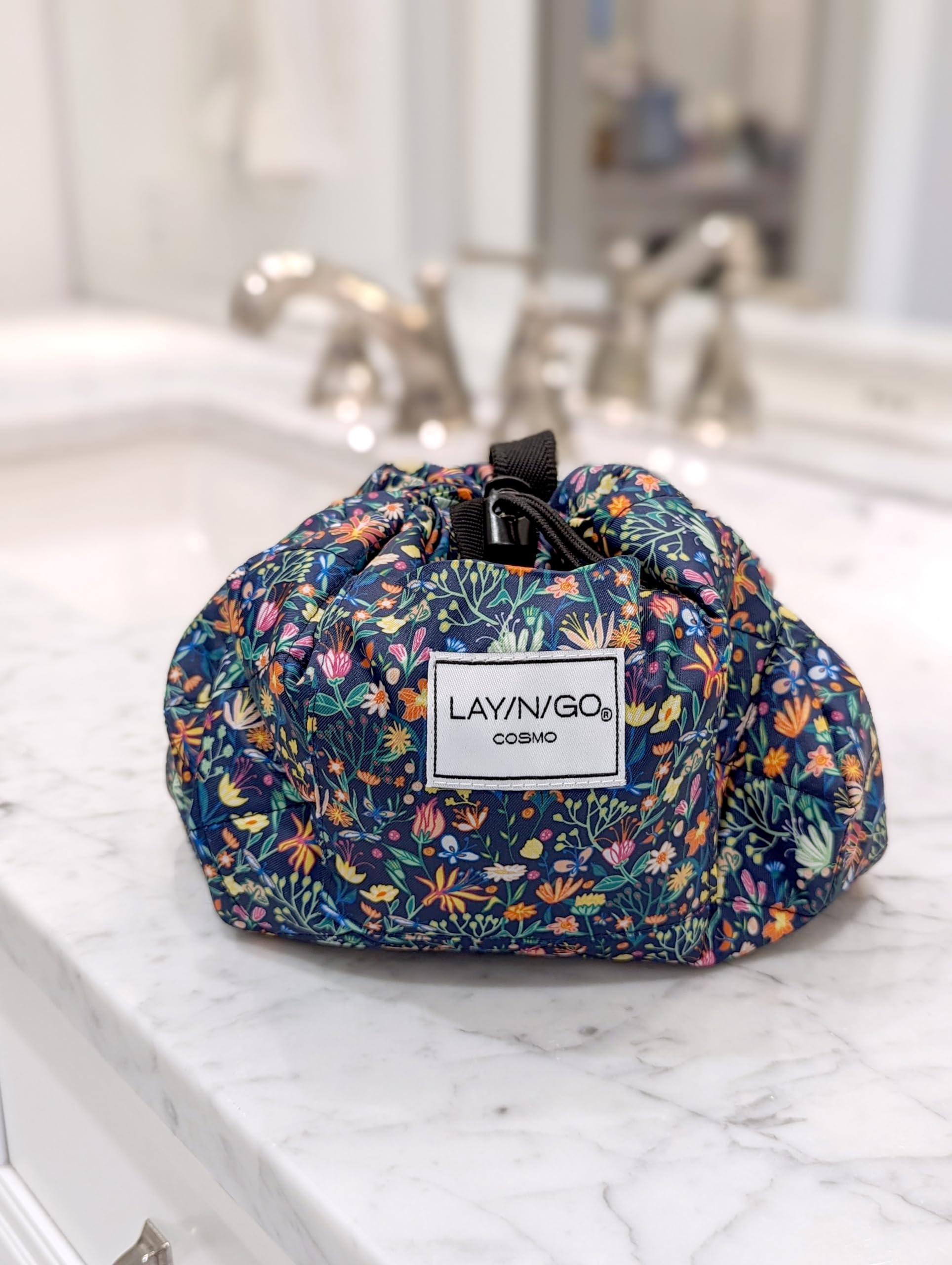 Lay-n-Go Cosmo butterfly small floral water-resistant fabric wipes clean after spills.