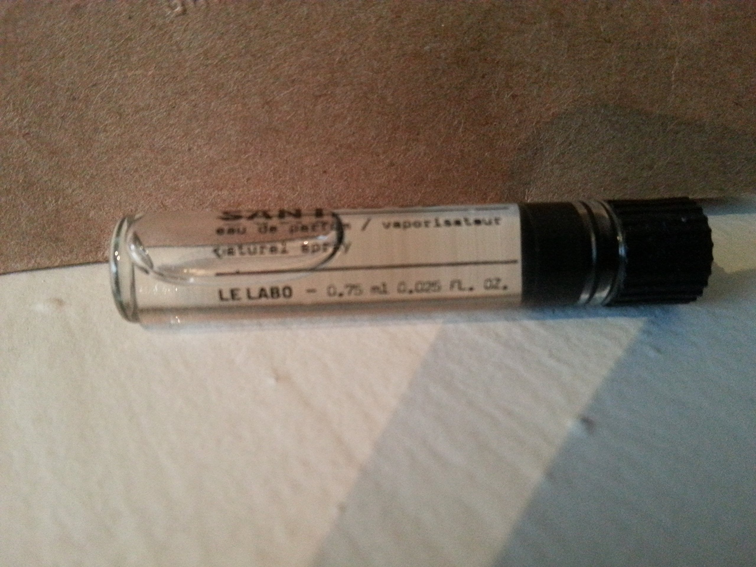 Le Labo Santal 33 sample vial reveals intimate fragrance on-the-go for travel touch-ups.