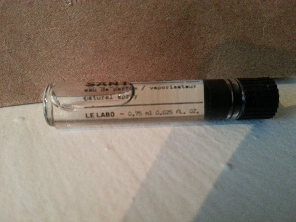 Le Labo Santal 33 sample vial reveals intimate fragrance on-the-go for travel touch-ups.