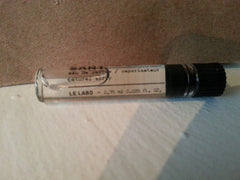 Le Labo Santal 33 sample vial reveals intimate fragrance on-the-go for travel touch-ups.
