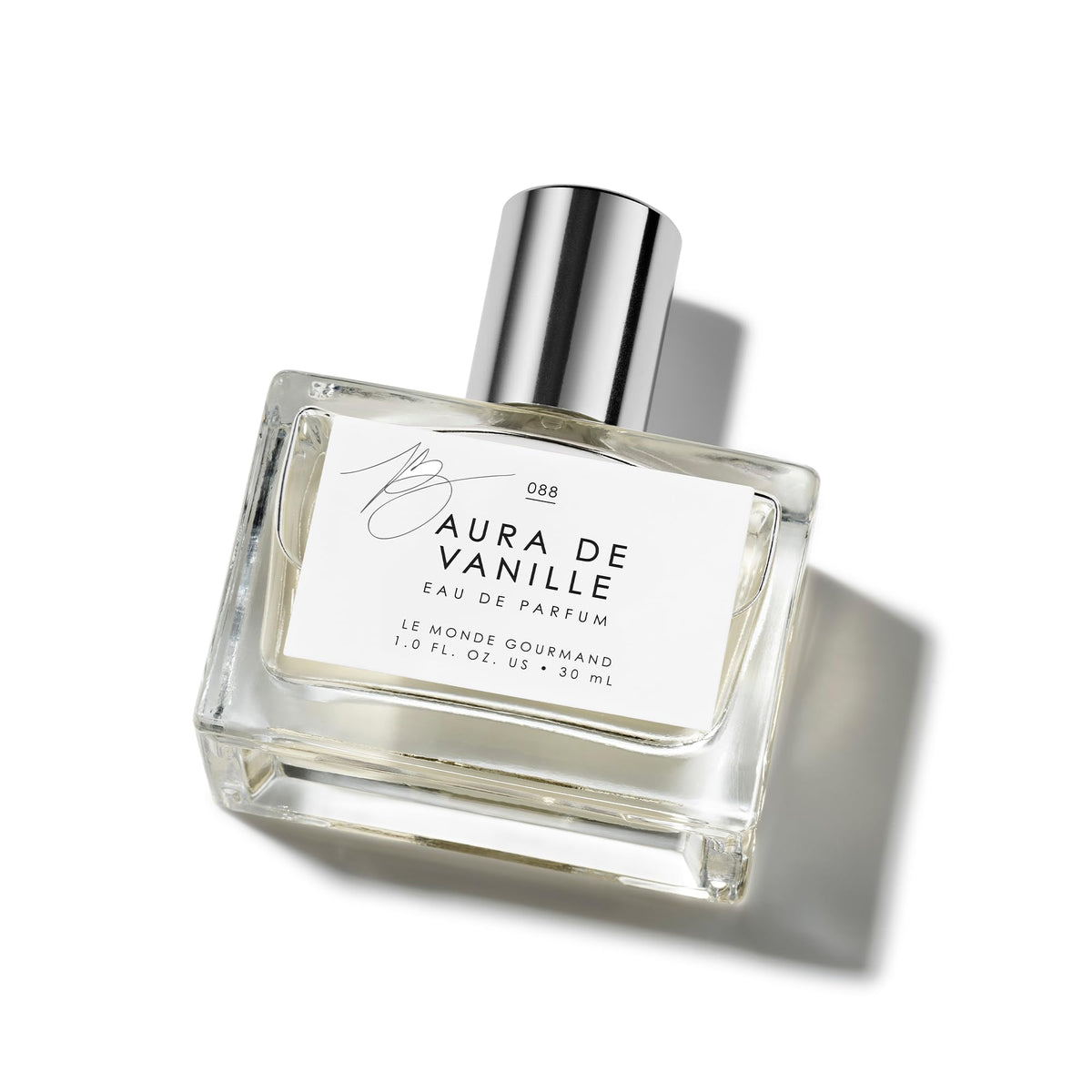 Le Monde Gourmand Aura de Vanille bottle closeup showing warm amber tones for evenings.