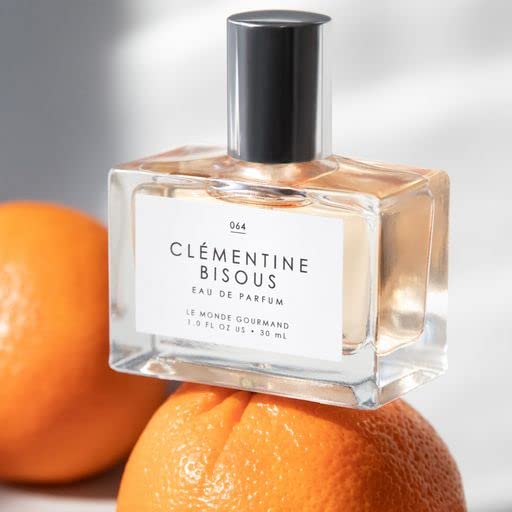Close-up of Clementine Bisous highlighting sandalwood warmth.
