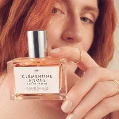 Clementine Bisous citrus top notes suggesting daytime freshness.