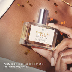 Confetti Dorés pulse-point application close-up for targeted scent moments.