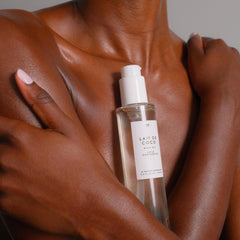 Swirl of Le Monde Gourmand Lait de Coco Body Oil on skin for hydration glow.