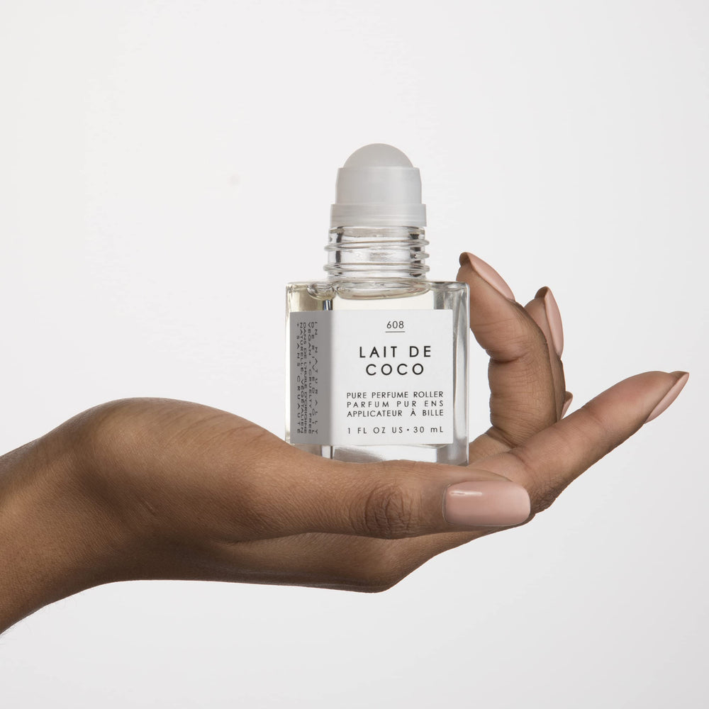Le Monde Gourmand Lait de Coco Perfume Oil on skin at pulse points for subtle glow.