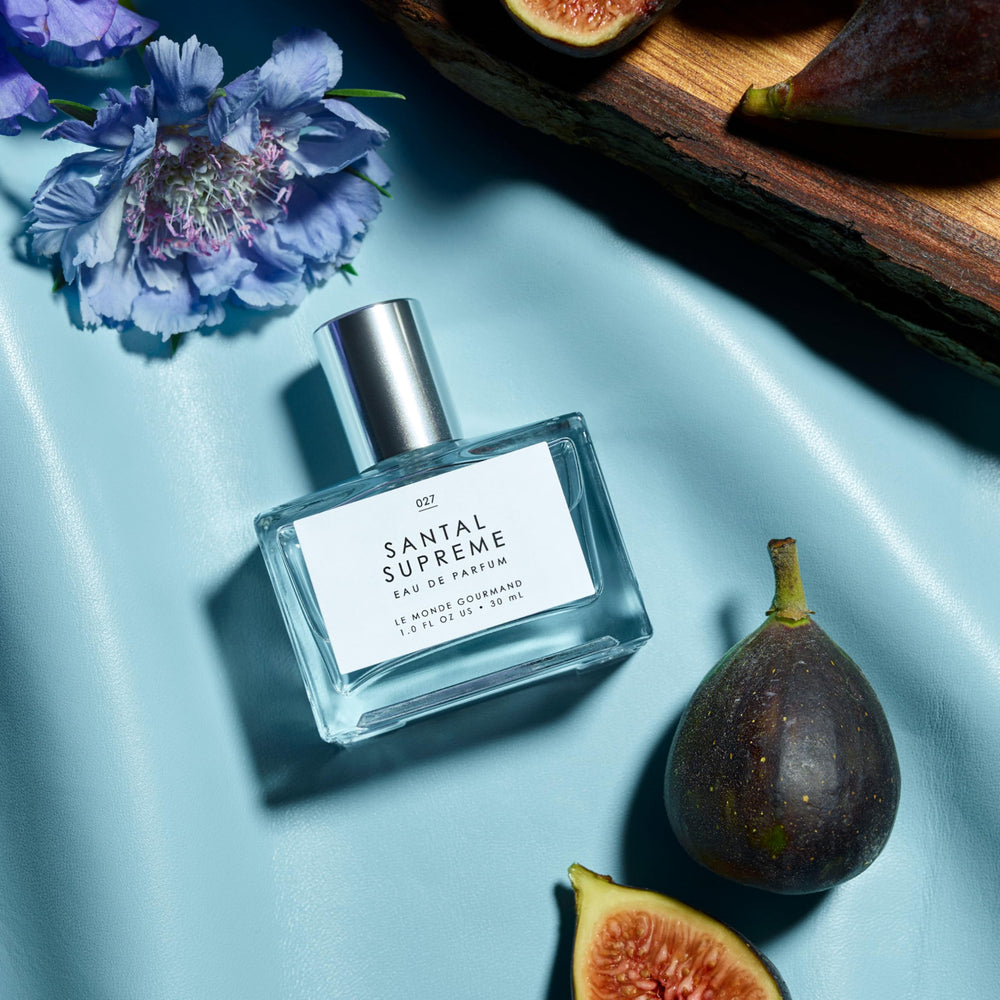 Santal Supreme close-up shows earthy vetiver and violet notes.