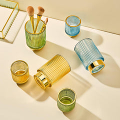 LEICURACE gold metal base detail keeps items stable on a vanity.