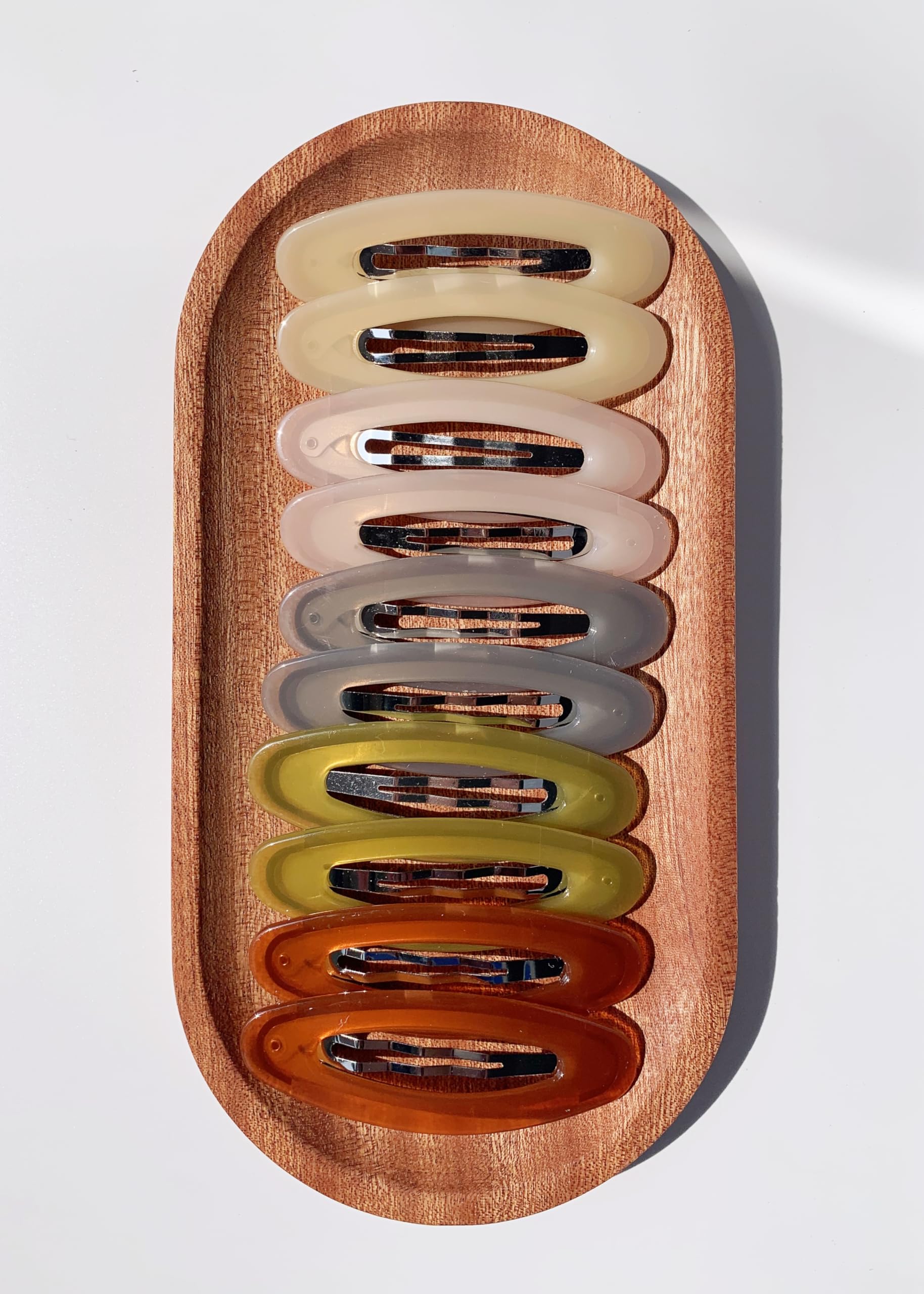 Lemeilleur gold-tone oval clip with firm grip for stylish looks.