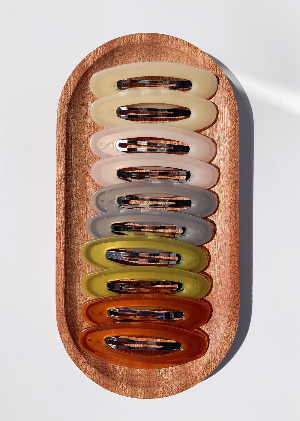 Lemeilleur gold-tone oval clip with firm grip for stylish looks.