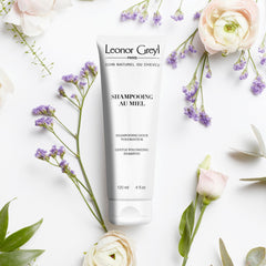 Leonor Greyl shampoo au miel bottle close-up highlights natural hydration.
