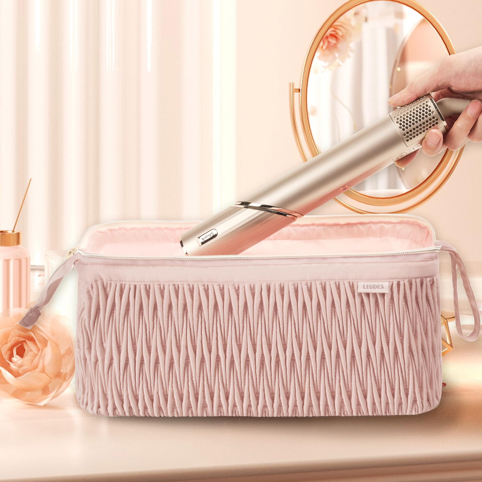 Leudes pink travel case opened to reveal quick-access layout for tools and attachments