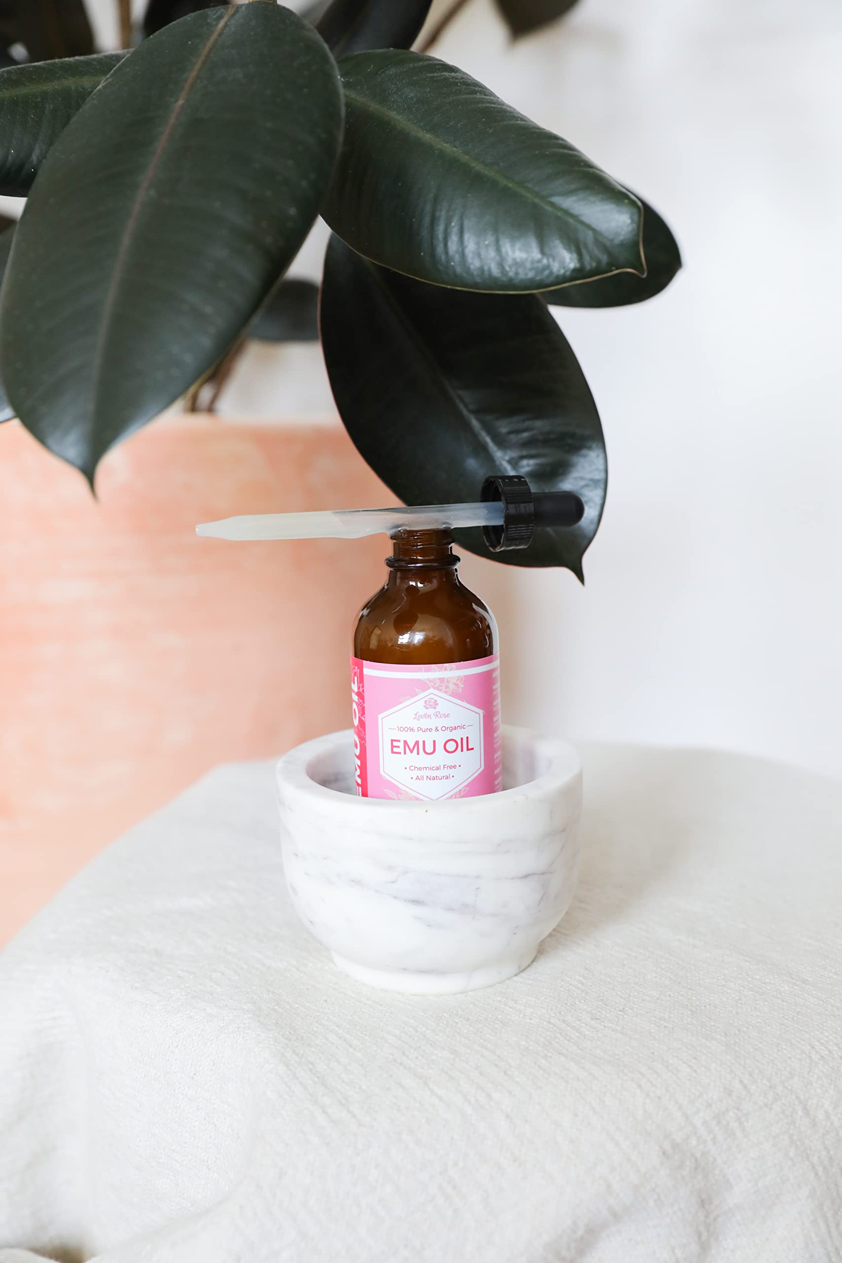 Leven Rose Emu Oil lip hydration for smoother lips.