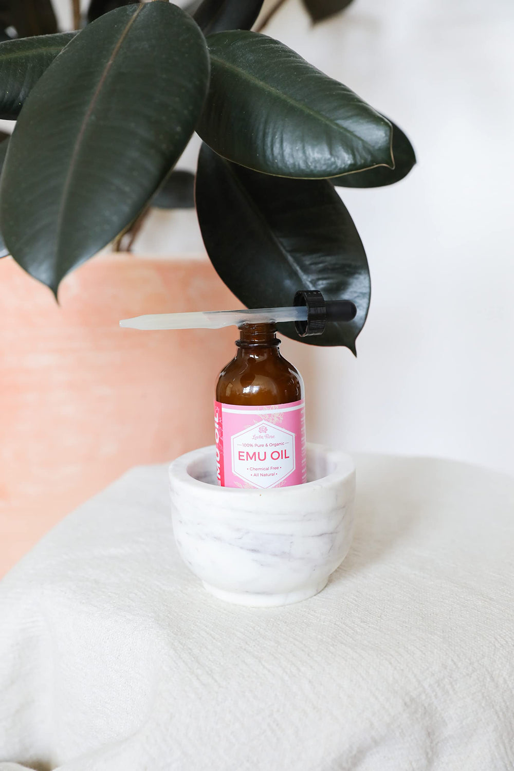 Leven Rose Emu Oil lip hydration for smoother lips.