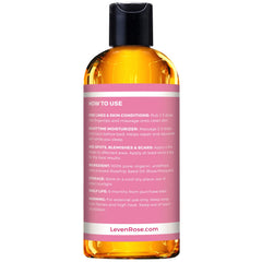 Leven Rose rosehip oil dropper dispenses oil on skin