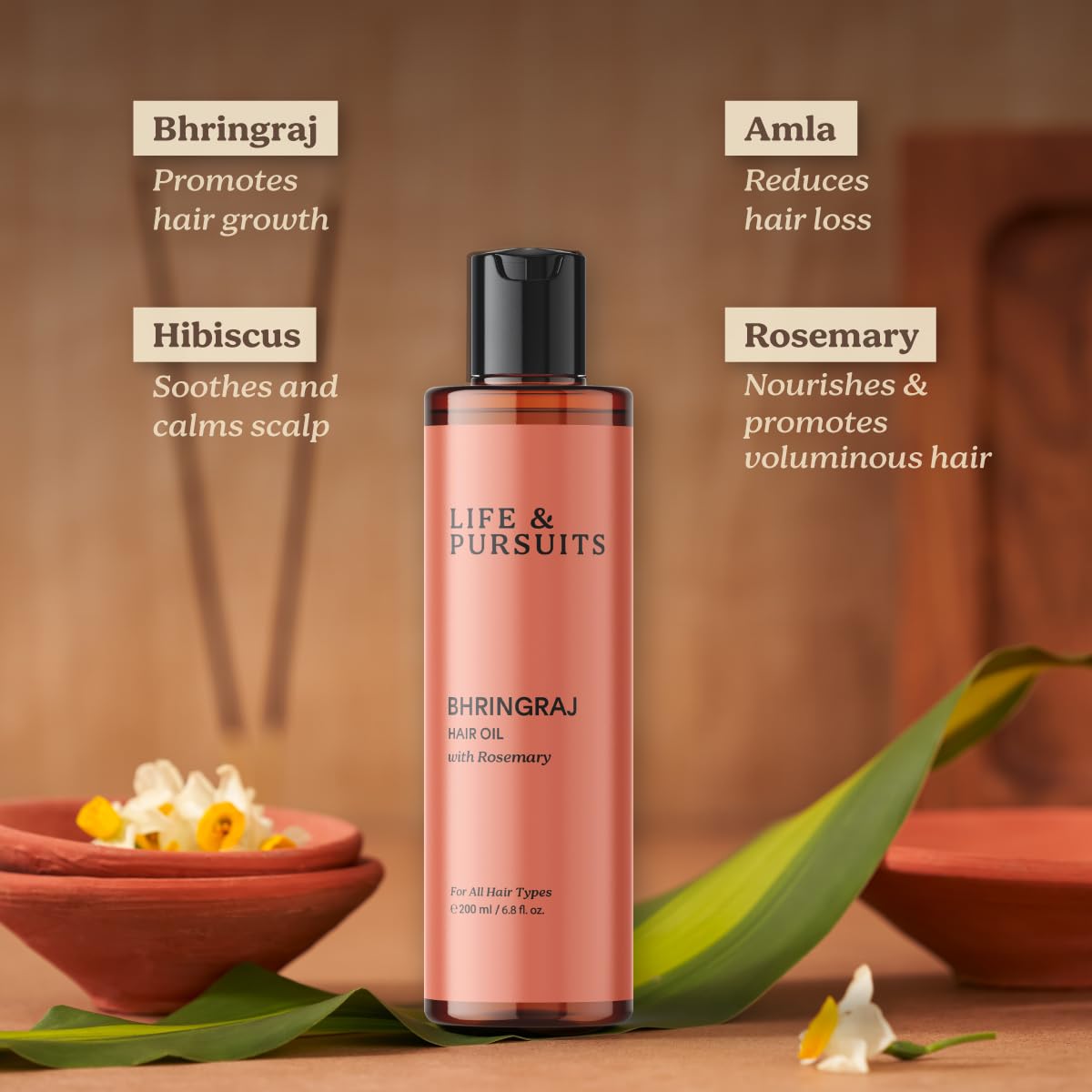 Life & Pursuits Rosemary-Amla-Hibiscus oil image shows botanicals supporting hair vitality.