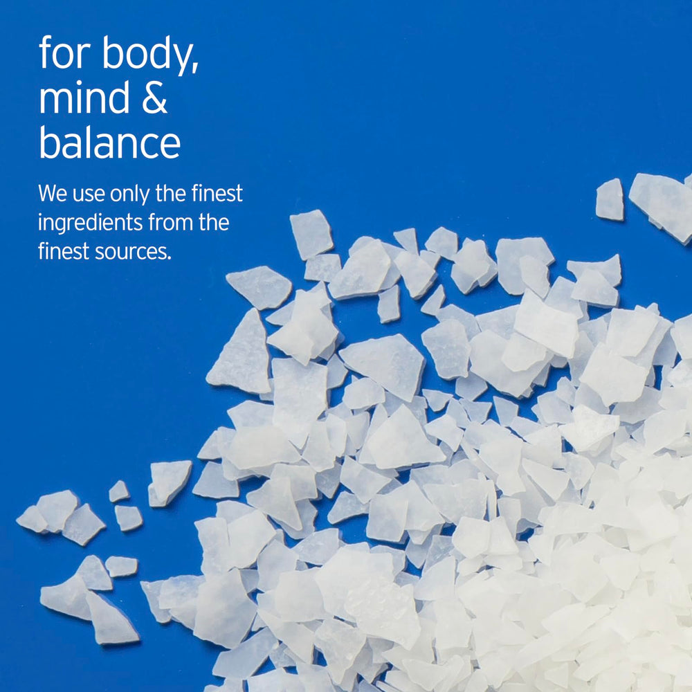 Close-up of LIFE-FLO magnesium bath flakes ingredients featuring magnesium chloride and minerals.
