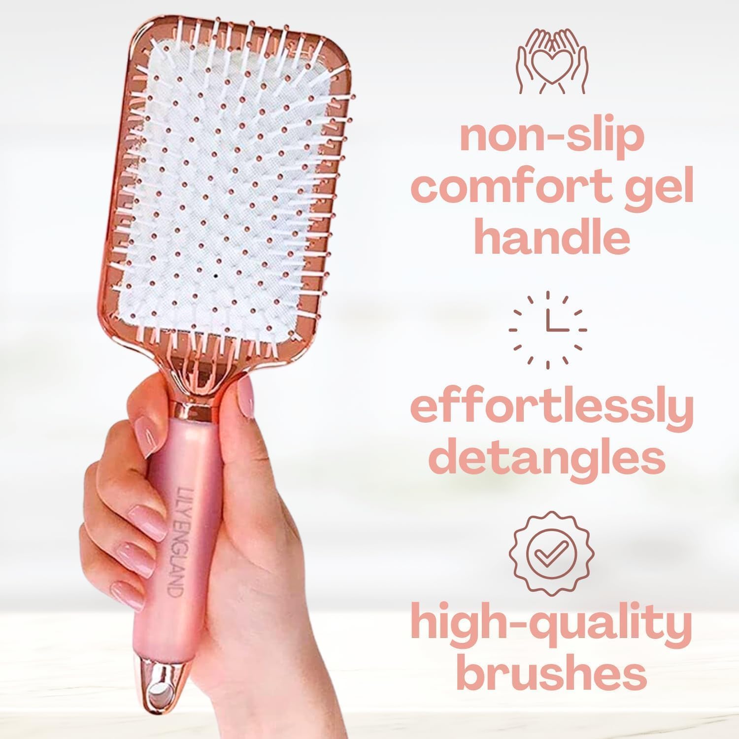 Lily England rose gold round brush for sleek heat styling with added shine.