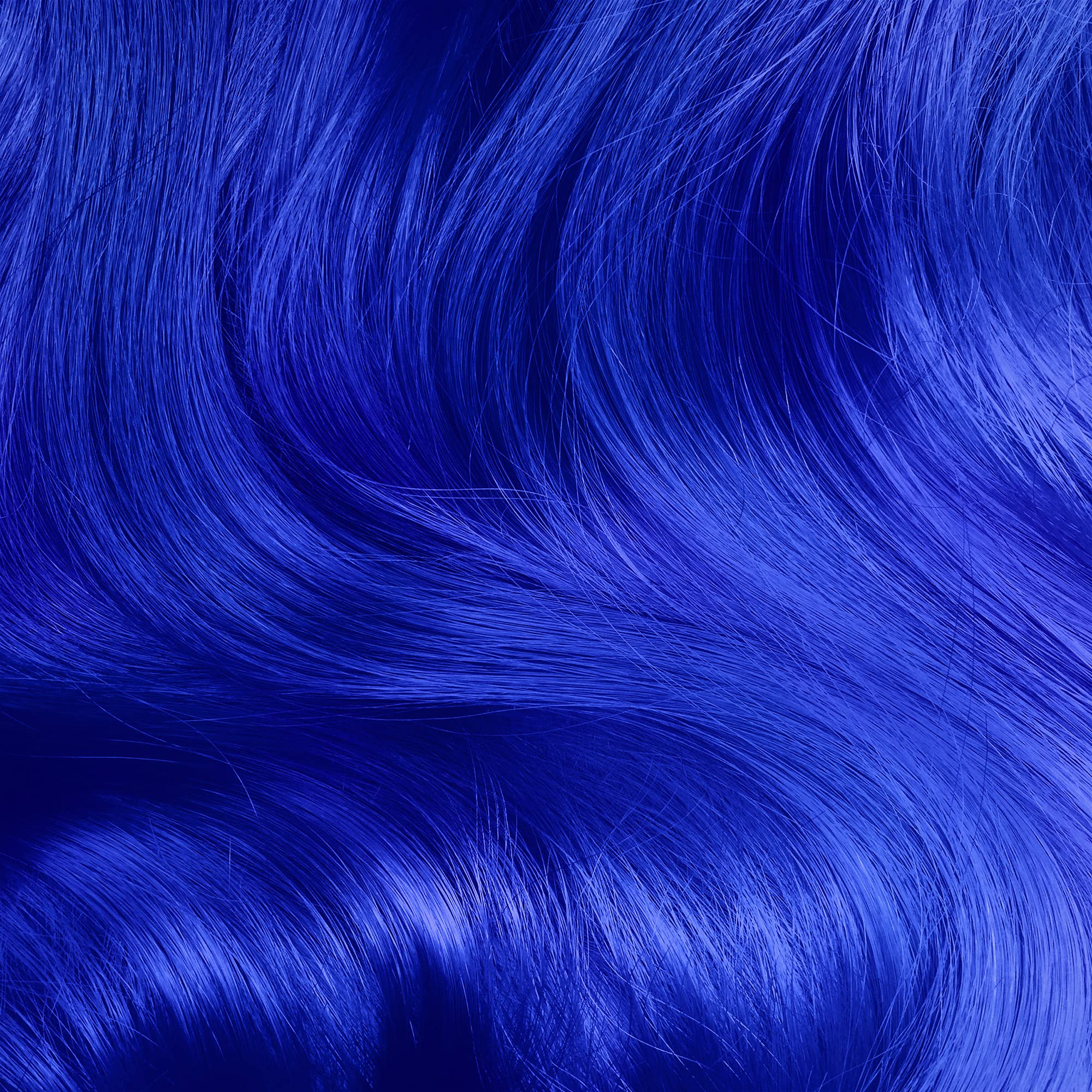 Lime Crime Unicorn Hair Dye Mystic application swirl demonstrates even coverage on pre-lightened hair.