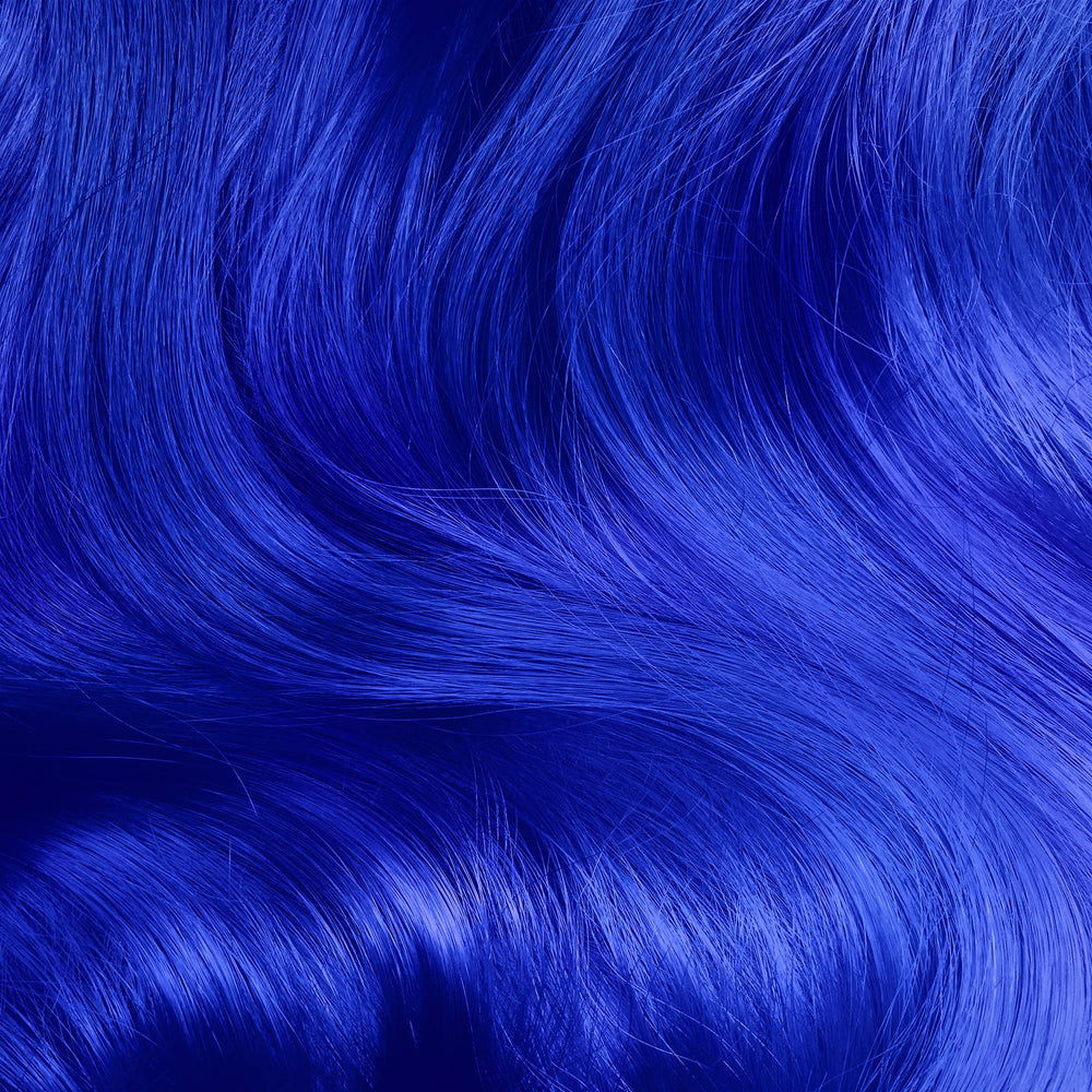 Lime Crime Unicorn Hair Dye Mystic application swirl demonstrates even coverage on pre-lightened hair.