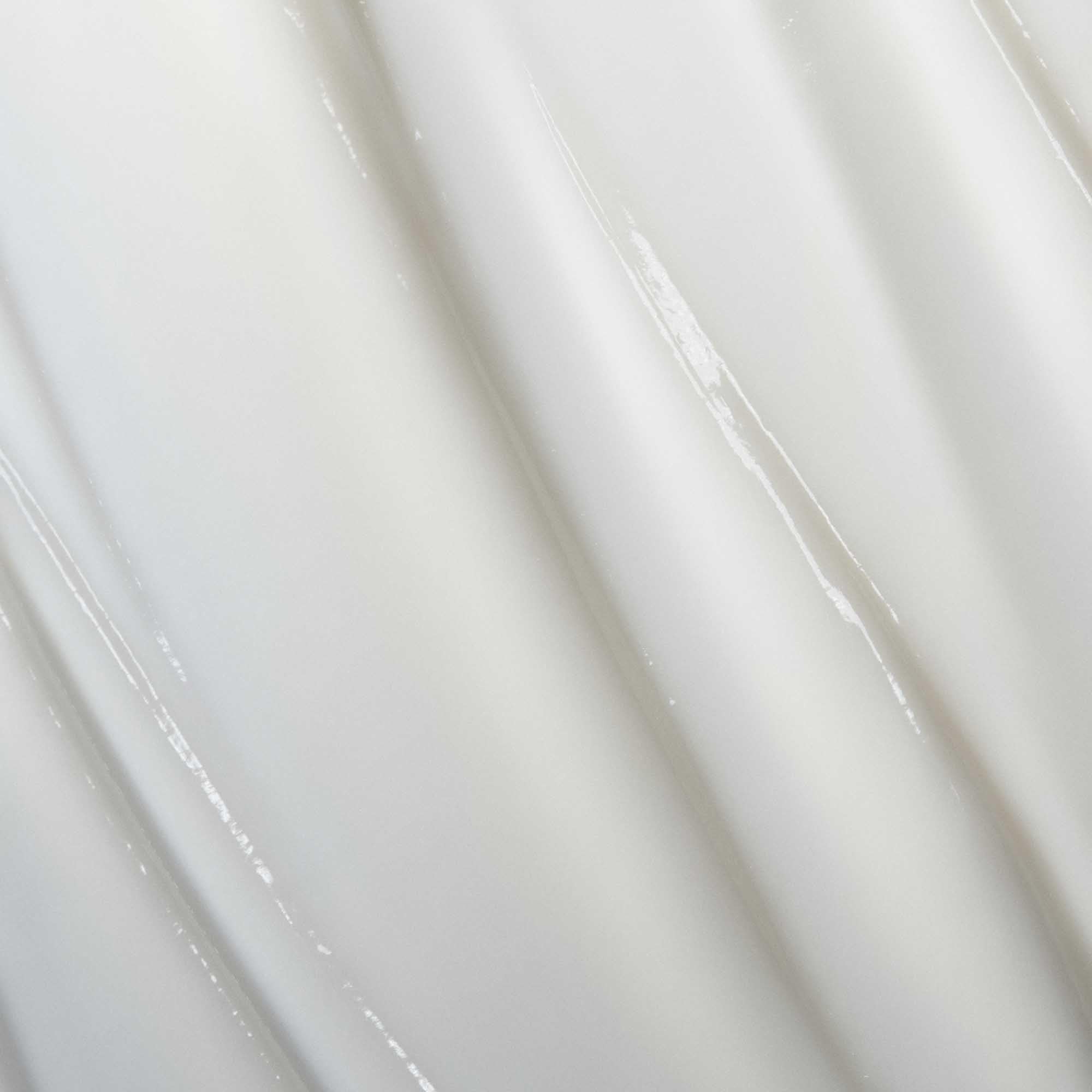 Living Proof Curl Conditioner detangling action demonstrates high slip that reduces snagging.