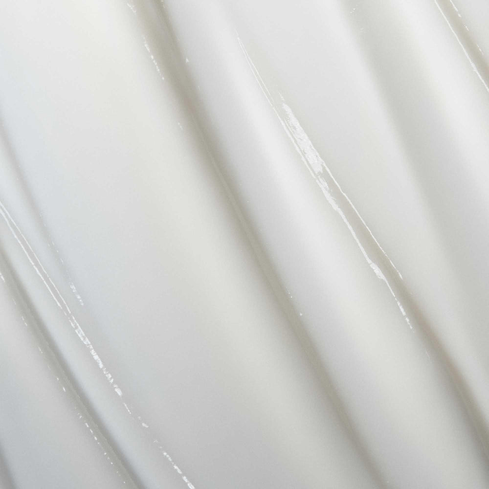 Living Proof Curl Conditioner detangling action demonstrates high slip that reduces snagging.