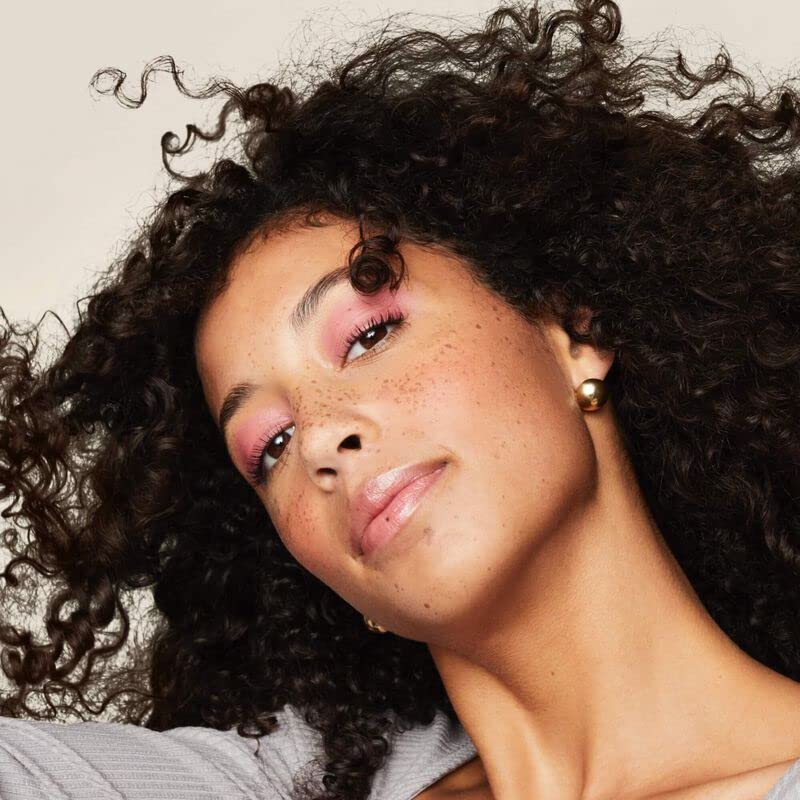 Living proof curl definer apply-into-curls closeup shows root-to-tip definition.