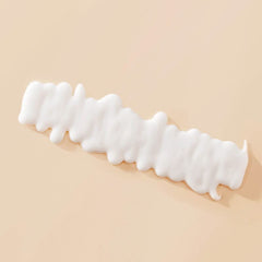 Living proof curl definer curls closeup highlighting bouncy, frizz-free shine.