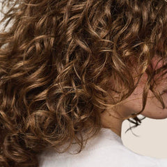 Living Proof Curl Enhancer packaging shot signals effortless conditioning.