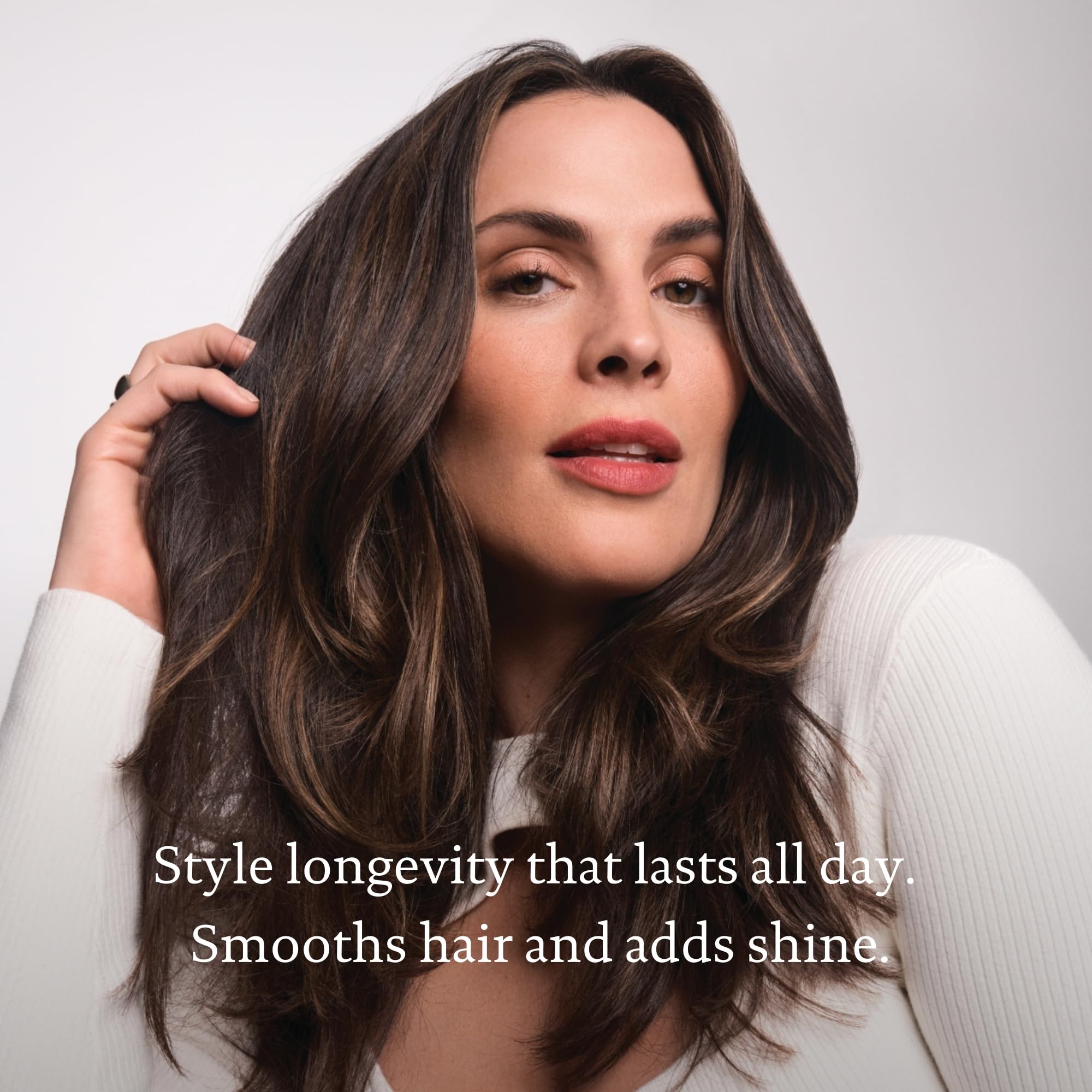 Living Proof Full Thickening Blow-Dry Cream pump dispenses silky product for even coating.