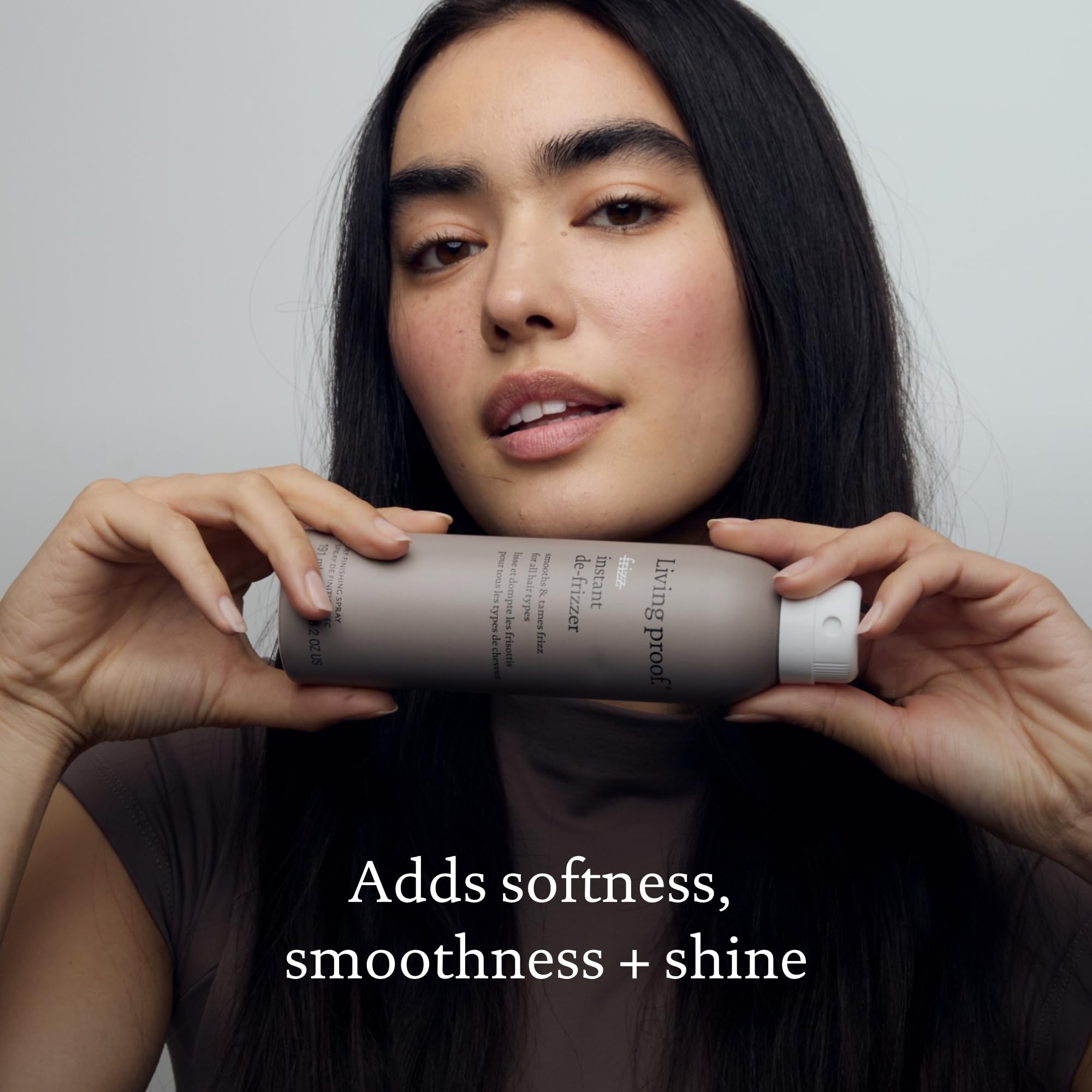 Living Proof No Frizz Instant De-Frizzer packaging on a shelf for easy on-the-go use.