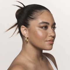 Living Proof No Frizz Smooth Serum on hair strands showing improved fiber alignment