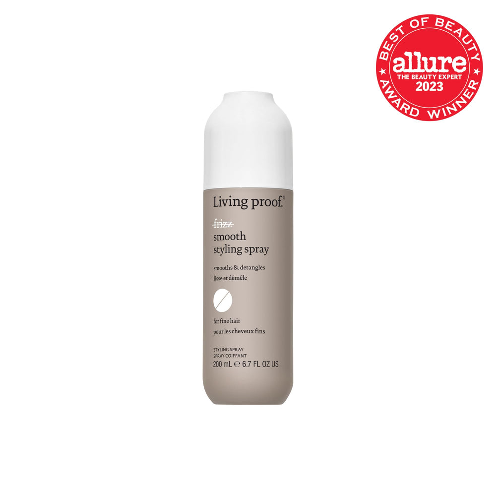 Living Proof No Frizz Smooth Styling Spray mist on hair for easy detangling and slip.