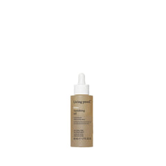 Living Proof No Frizz Vanishing Oil bottle provides lightweight frizz control and shine.