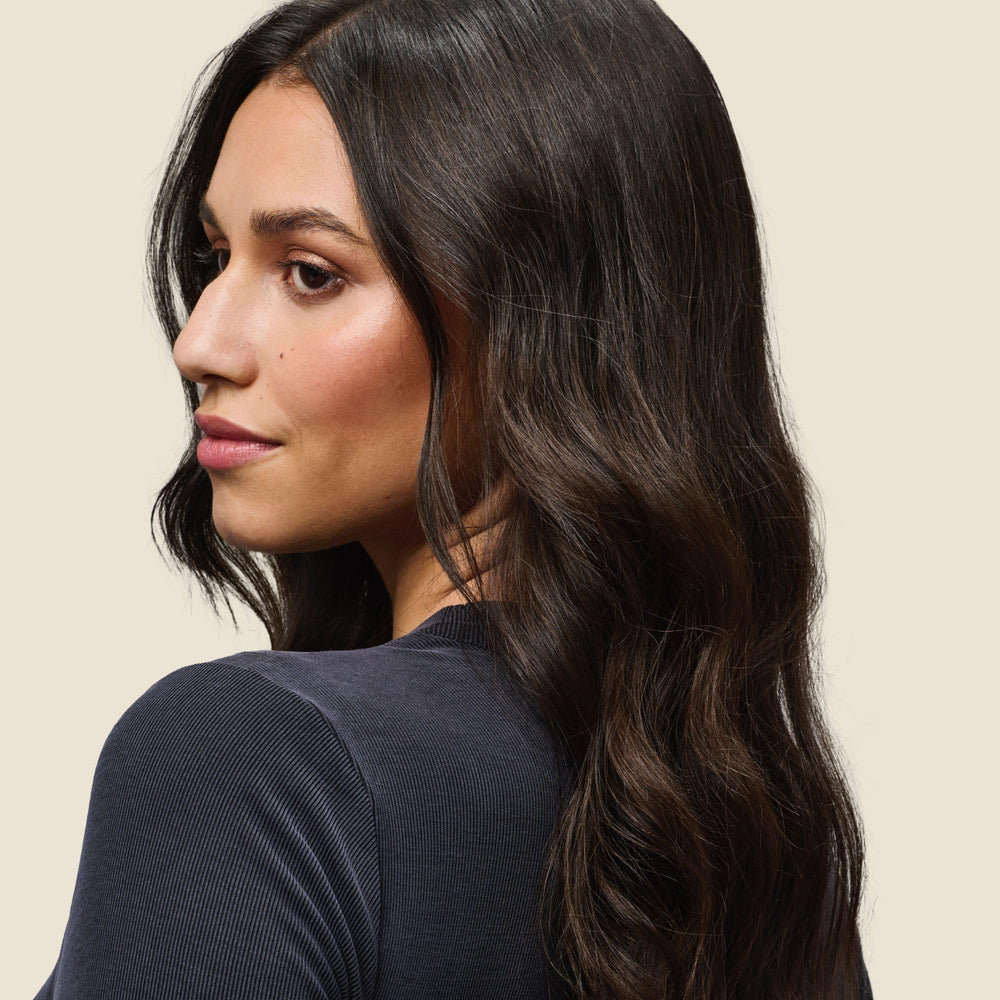 Living Proof No Frizz Vanishing Oil close-up highlights silky weightless finish.